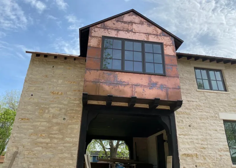 Copper metal panel facade on a stone building for Skylight Installation in Streetsboro