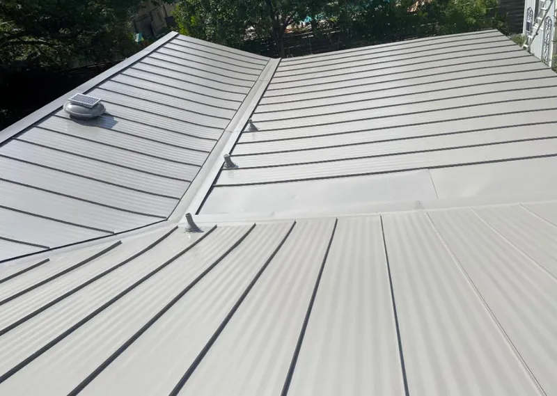 Solar attic fan installed on a metal roof for Roof Ventilation in Streetsboro